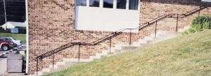 railing along staircase on side of building, custom metal railings